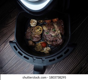 Grilled Beef Steak With Rosemary, Salt,tomatoes,mushrooms In Air-fryer Machine.Delicious Grilled Steaks With Vegetables Inside An Air Fryer Tray.