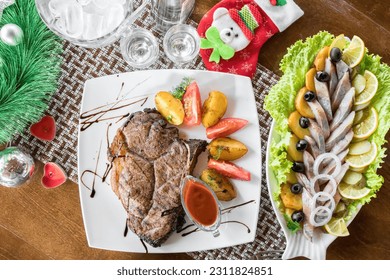 Grilled Beef Steak with some potatoes and cherry tomatoes, top view - Shutterstock ID 2311824851