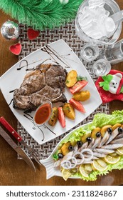 Grilled Beef Steak with some potatoes and cherry tomatoes, top view - Shutterstock ID 2311824867