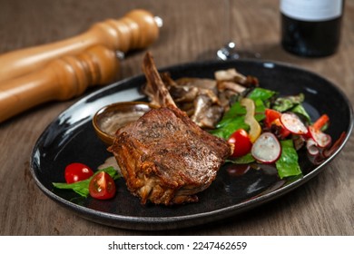 grilled beef steak with vegetables and spices on wooden table - Shutterstock ID 2247462659