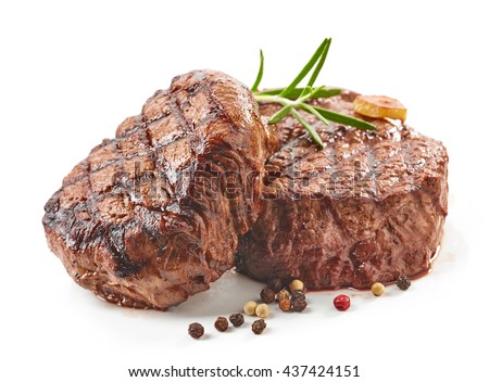 grilled beef steaks with spices isolated on white background