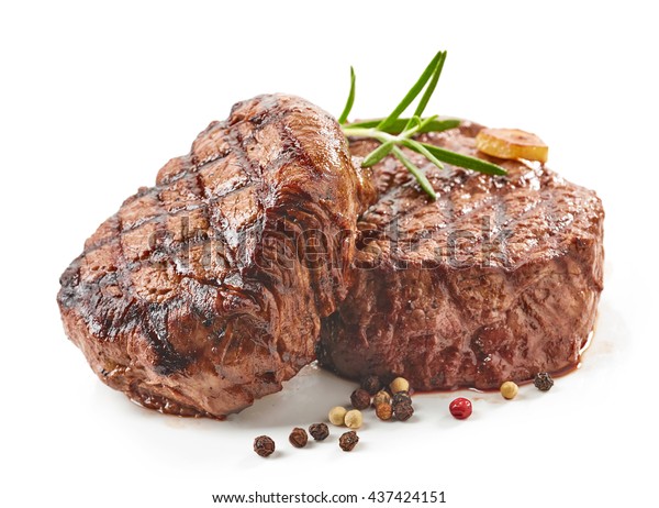 grilled beef steaks with spices isolated on\
white background