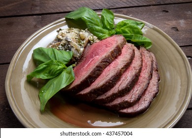 Grilled beef tenderloin with basil and mushrooms
