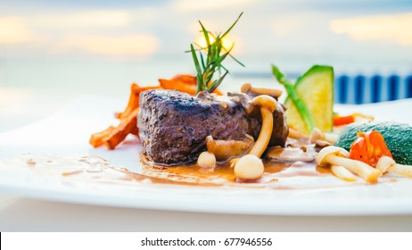 Grilled Beef Tenderloin Meat Steak With Vegetable In White Plate - Color Filter Processing
