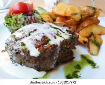 Grilled Beef Tenderloin Steak Blue Cheese Sauce With Salad And Fried Potatoes