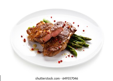 Grilled Beefsteak With Asparagus On White Background