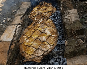 Grilled Carp On A Traditional Stove