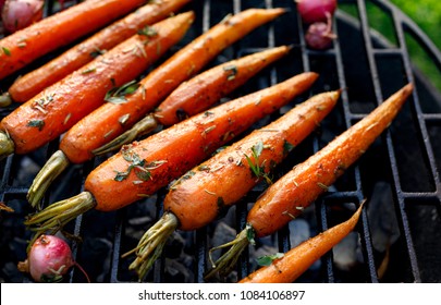 Grilled Carrots In A Herbal Marinade On A Grill Plate, Outdoor, Top View. Grilled Vegetarian Food, Bbq