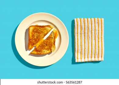 Grilled Cheese Sandwich On A Plate On A Blue Background