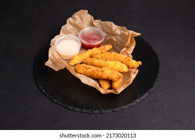 Grilled Cheese, Cheese Sticks On A Black Background, Side View