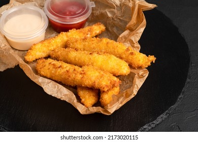 Grilled Cheese, Cheese Sticks On A Black Background, Side View