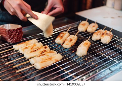 Grilled Cheese Sticks On Gas Griller Stove, Street Food At Ximending In Taiwan, Taipei.