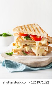 Grilled Cheese And Tomato Sandwich On White Background