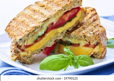 Grilled Cheese And Tomato Sandwich On A Plate