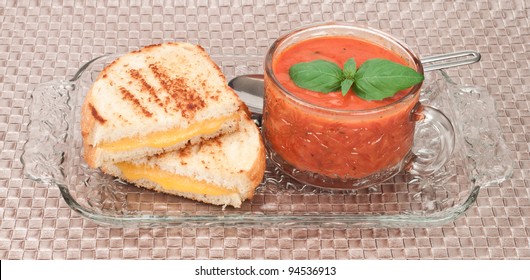 Grilled Cheese And Tomato Soup Decorated With Fresh Basil