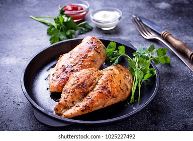 Grilled chicken breast or fillet on iron pan. Top view - Powered by Shutterstock