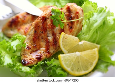 Grilled Chicken Breast With Fresh Lettuce And Lemon