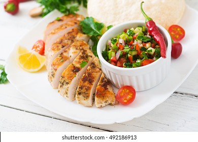 Grilled Chicken Breast With Fresh Tomato Salsa And Pita.