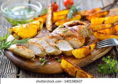 Grilled Chicken Breast With Lemon Dipping Sauce And Rosemary Potato Wedges