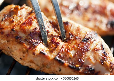 Grilled Chicken Breast On Barbeque, Cooking Process. Macro Shot, Shallow Depth