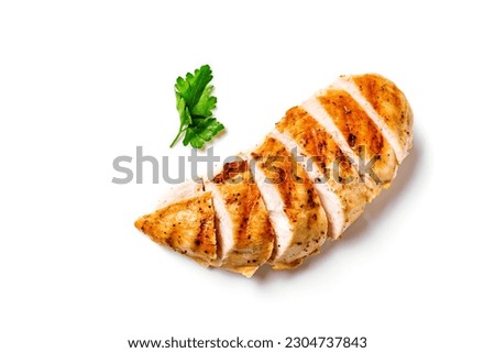 Grilled chicken breast. Sliced spicy roasted chicken fillet isolated on white background.