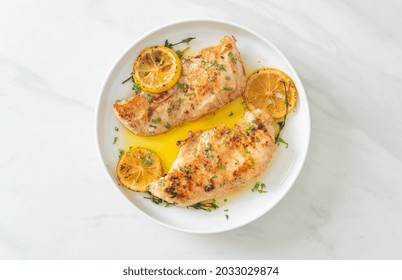 Grilled Chicken With Butter, Lemon And Garlic On White Plate