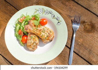 Grilled chicken drumstick with vegetable on nice plate - Shutterstock ID 196104299