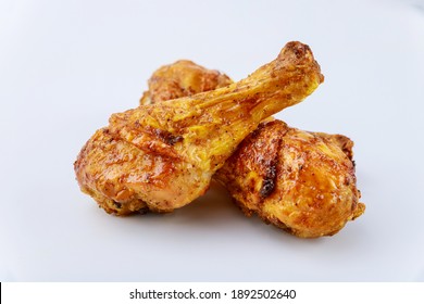 Grilled Chicken Drumsticks Marinated With Buffalo Sauce Isolated On White Background. Close Up.