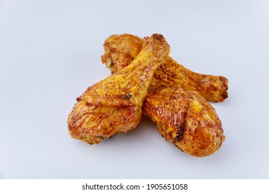 Grilled Chicken Drumsticks Marinated With Buffalo Sauce Isolated On White Background. Close Up.