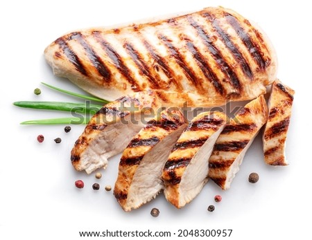 Grilled chicken fillet with herbs isolated on white background.