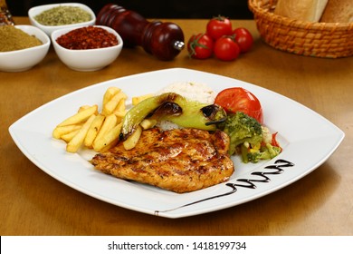 Grilled Chicken fillet meat with vegetable on plate 