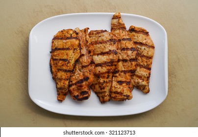 Grilled Chicken Fillet On A White Plate