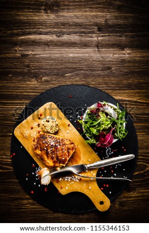 Similar – Image, Stock Photo Marinated heart-shaped chicken breast fillet with rubbing brush