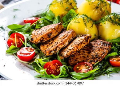 Grilled Chicken Fillet And Vegetables On White Plate