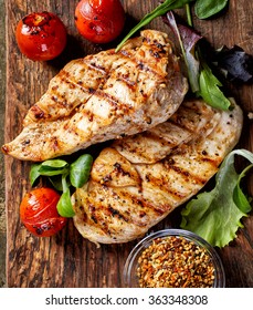 Grilled chicken fillets and vegetables, top view