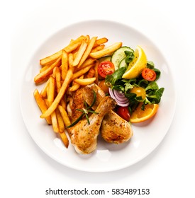 Grilled Chicken Legs With Chips And Vegetables 