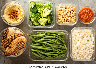 Grilled chicken meal prep with cooked rice and vegetables - Shutterstock ID 1069332170