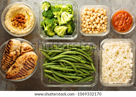 Grilled chicken meal prep with cooked rice and vegetables