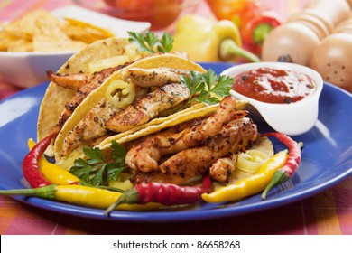 Grilled Chicken Meat, Vegetable And Hot Chili Peppers In Taco Shells