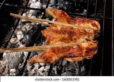 Grilled Chicken On Charcoal Stove. Roasting Chicken On Smoked Grill Barbecue