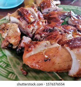 Grilled Chicken On  Green Plate On Wood Table And Flavoring Spicy Chicken Sauce, Delicious Crispy Chicken Skin, Tight Texture, Best Of Menu Thai Food.