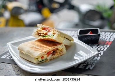 Grilled Chicken Panini Sandwich On The White Plat 