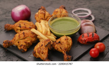 Grilled Chicken Pieces With Potatoes, Soup And Grilled Vegetables