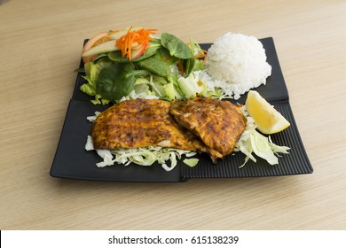 Grilled Chicken Plate With Seasoning, Rice, And Salad