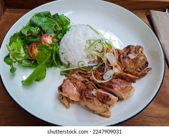 Grilled chicken, salad and white rice, a combination of low calorie menu for diet - Shutterstock ID 2247909031
