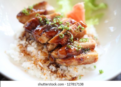 Grilled Chicken teriyaki rice on wood background