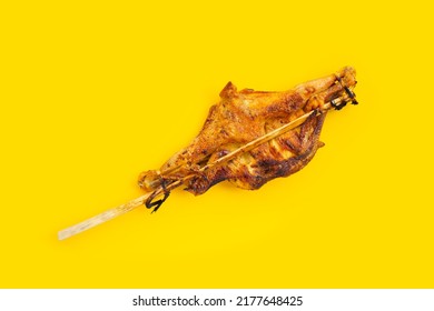 Grilled chicken, Thai style food on yellow background.