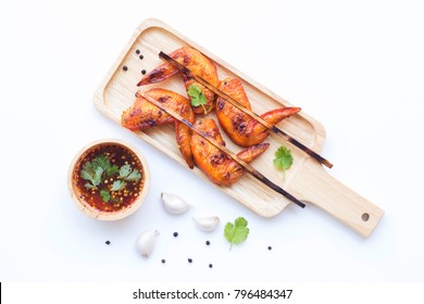 Grilled Chicken Wings In Wooden Dish With Vegetable And Spices Flat Lay On White Background, Food Ideas Concept 