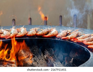 Grilled Cooked Shrimp With Smoke And Flames Grill. Grilled Fish Food Outdoor Summer Family Party Picnic In The Park.