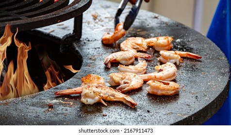 Grilled Cooked Shrimp With Smoke And Flames Grill Background. Grilled Fish Food Outdoor Summer Family Party Picnic In The Park.